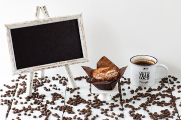 a plate for text, a muffin and a cup of coffee on the table
