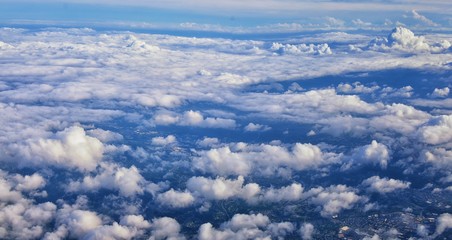 Naklejka na ściany i meble Aerial Cloudscape view over midwest states on flight over Colorado, Kansas, Missouri, Illinois, Indiana, Ohio and West Virginia during autumn. Grand sweeping views of landscape and clouds. Views of cr