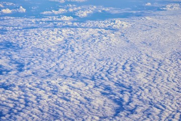 Aerial Cloudscape view over midwest states on flight over Colorado, Kansas, Missouri, Illinois, Indiana, Ohio and West Virginia during autumn. Grand sweeping views of landscape and clouds. Views of cr