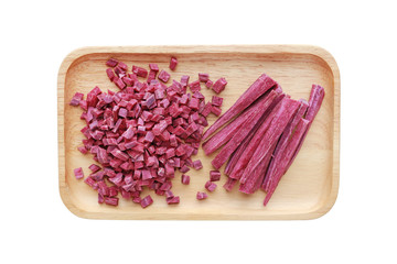 Chopped and sliced purple sweet potato in wood tray isolated on white background.