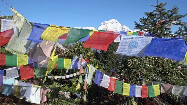 Buddhist Prayer Flags Hanging along Hiking Paths in Nepal. Trekking in the Himalayas