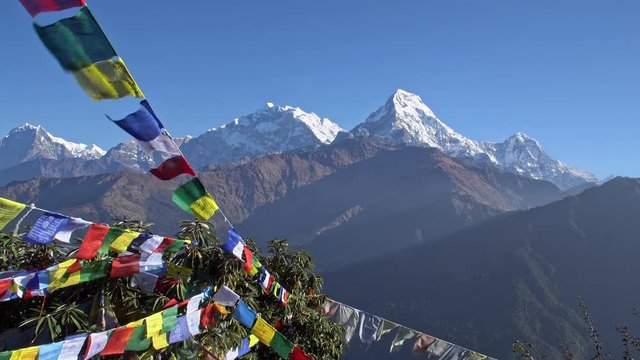 Buddhist Prayer Flags Hanging along Hiking Paths in Nepal. Trekking in the Himalayas