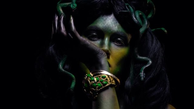 Close up of mythical Medusa Gorgon moving her hand, slow motion