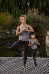 Mother and son exercising  yoga  pose
