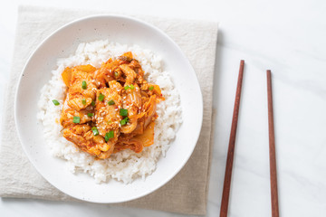 stir-fried pork with kimchi on topped rice