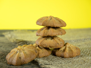 Fototapeta na wymiar Cookies put together in yellow background