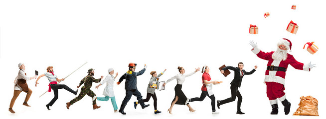 Collage of different professions. Group of men, women in uniform running at studio with Santa isolated on white. Full length of people with different occupations. Christmas and holiday concept