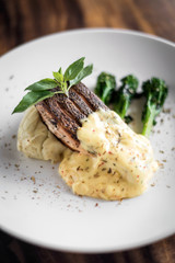grilled salmon fish fillet with mashed potato and mustard sauce