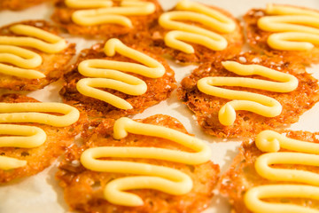 Freshly baked oatmeal lace cookies with vanilla buttercream icing.