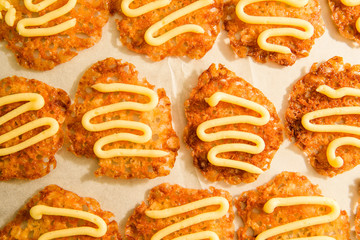 Freshly baked oatmeal lace cookies with vanilla buttercream icing.