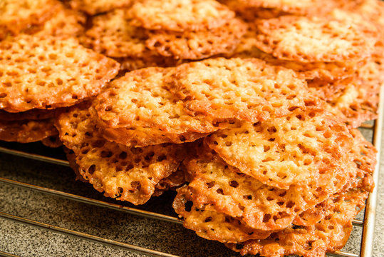 Freshly Baked Oatmeal Lace Cookies Resting On Oven Rack.