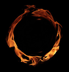 fire - a ring created by the flame and large burning flames on a black background - 232920348