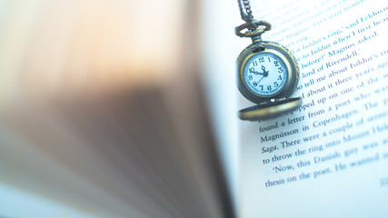 OLYMPUS Watch locket put it on old books. Concept  I want to keep it all the time in memory.DIGITAL CAMERA