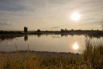 Sunset in a reservoir of daimiel tables