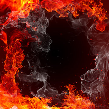 Fire - fiery background - red flames, sparks and waving white smoke on a black background