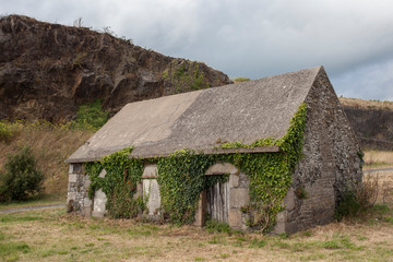 Fototapeta na wymiar Granville France september 17 2018. Old house covered by ivy in Granvile Normandy, France
