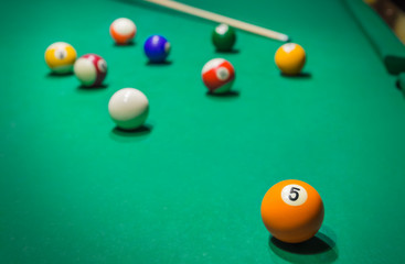 Billiard balls on pool green table