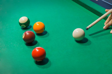 Billiard balls on pool green table