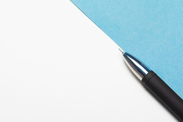 Top view workspace mockup on blue background with notebook, pen