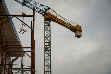 Naklejka premium tower crane in a residential construction site