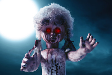 Scary bloody doll with red eyes