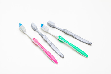 Flat lay composition with manual toothbrushes on color background, close up