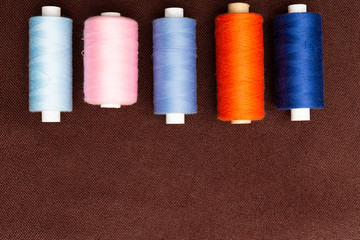 Spools of thread with copy text area.
