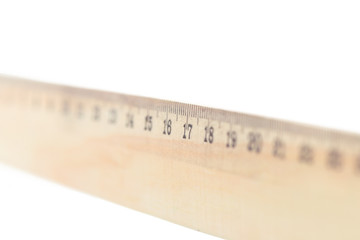 Wooden ruler macro shot isolated on white background