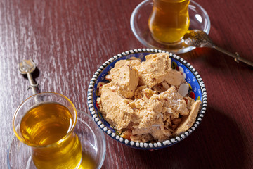 Tasty halva with tea on the table