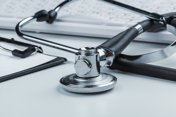 Stethoscope With Laptop on the table