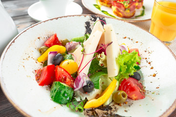 Greek salad with fresh vegetables, feta cheese close up