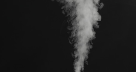 closeup vapor stream rises from bottom center on black background