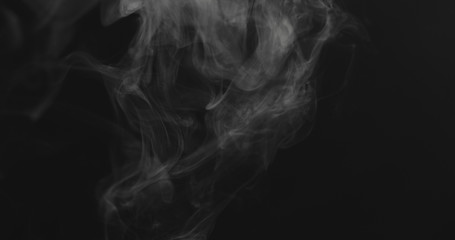 closeup vapor floating in air on black background