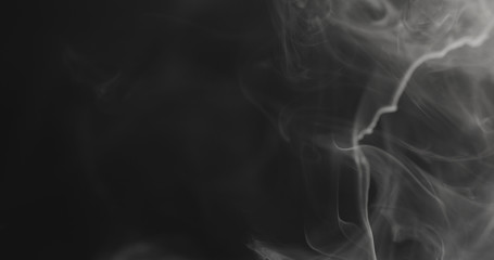 closeup vapor floating in air on black background