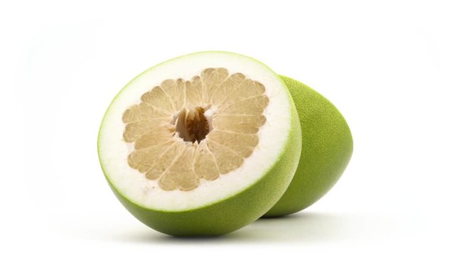 Two halves of big shaddock pomelo fruit. Rotating on the turntable. Isolated on the white background. Close-up. Macro.