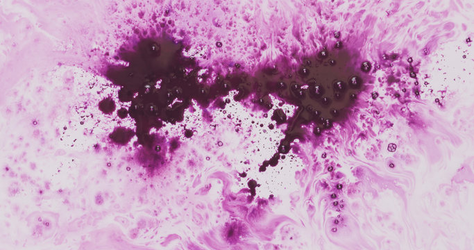 Purple Ink Drops Spreads On White Wet Paper