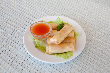 rolls with meat filling and spicy sauce on the table