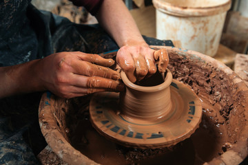 Potter at work. Workshop place.