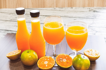 Fresh orange juice and bottled orange