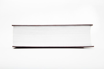 blank mock up of big closed book with copy space isolated on the white background.