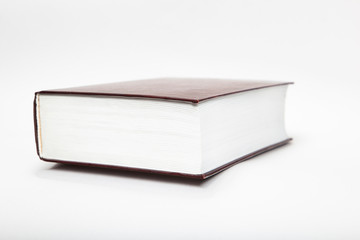 blank mock up of big closed book with copy space isolated on the white background.