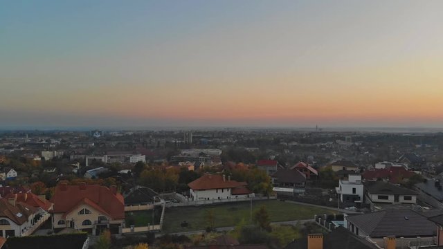 Aerial view of middle class houses in small village or town in the countryside. Top view above houses at sunrise above in the autumn Uzhhorod Ukraine Europe