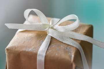 gift box with ribbon on wooden background