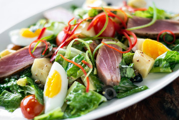 fresh seared raw tuna mixed vegetable salad  with mustard sauce