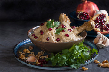 Satsivi - a cold Georgian dish made from boiled  chicken pieces and walnut sauce (garlic, dried herbs, walnuts, vinegar), pomegranate.
