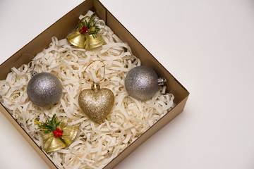 christmas decorations in the box on the white background