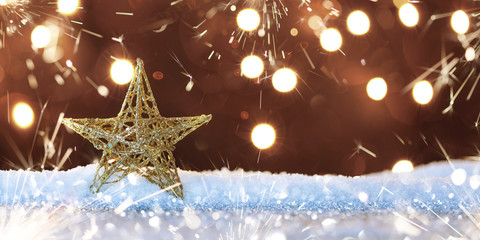 christmas star on snow with magic lights