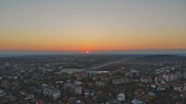 Drone is turning right Beautiful small village or township in the autumn forest. A lot of houses roofs around. Uzhhorod Ukraine Europe