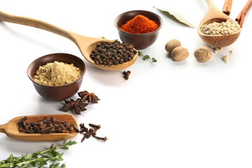 Composition with different spices on white background