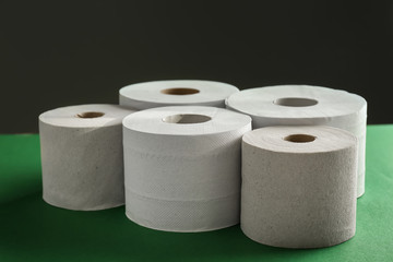 Rolls of toilet paper on color table
